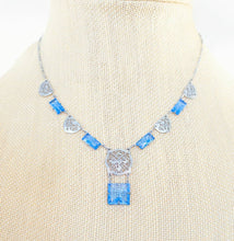 Load image into Gallery viewer, Vintage art Deco pale blue Czech glass open back rhodium plated filigree link necklace
