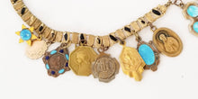 Load image into Gallery viewer, Vintage religious gold filled blue enamel Catholic medals loaded assemblage charm necklace on book chain
