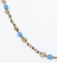 Load image into Gallery viewer, Vintage handmade boho brass crucifix on blue glass beaded filigree chain neckace
